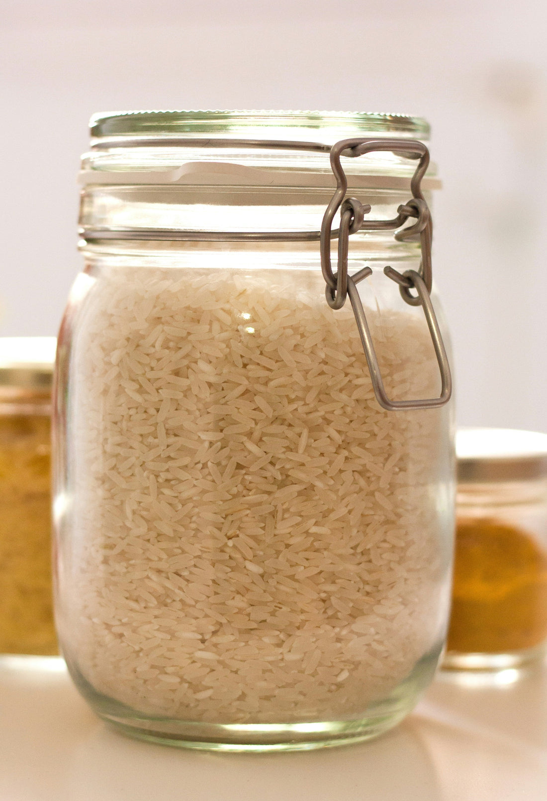 Jar of white rice used to prepare rice water rinse for hair growth
