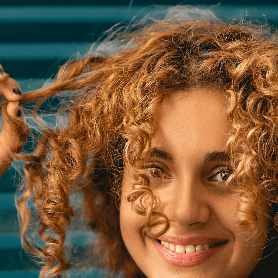 Short curly hair with tight ringlets, styled for definition and volume